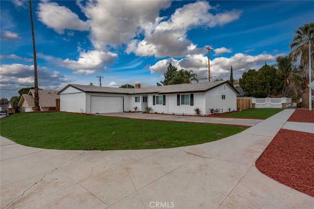 ranch-style house with a garage and a front lawn