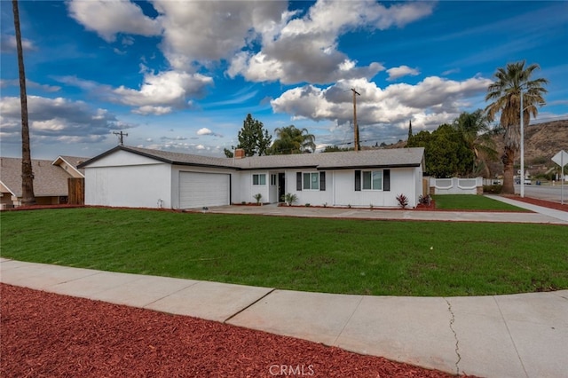 single story home with a garage and a front yard