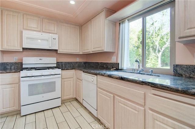 8566 Larkhall Cir Unit 809D, Huntington Beach, CA 92646 - kitchen with ornamental molding, white appliances, dark stone counters, and a sink
