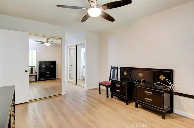 8566 Larkhall Cir Unit 809D, Huntington Beach, CA 92646 - sitting room featuring a ceiling fan, baseboards, and light wood finished floors