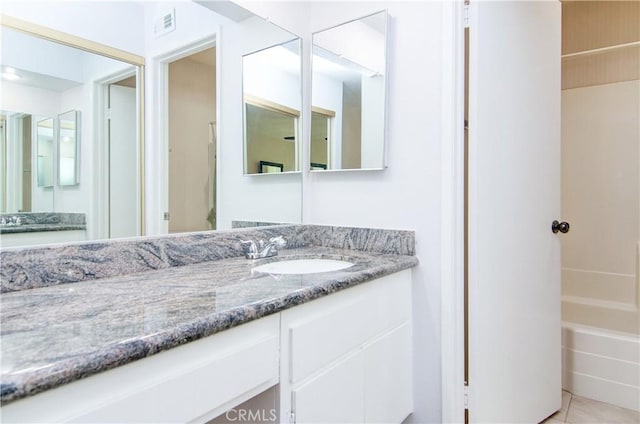 8566 Larkhall Cir Unit 809D, Huntington Beach, CA 92646 - full bath featuring a bath, visible vents, tile patterned floors, and vanity