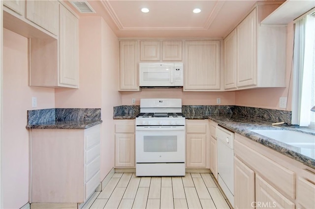 8566 Larkhall Cir Unit 809D, Huntington Beach, CA 92646 - kitchen with white appliances, visible vents, dark stone counters, recessed lighting, and a sink