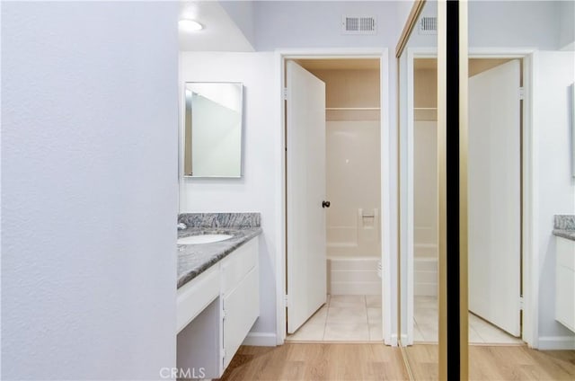 8566 Larkhall Cir Unit 809D, Huntington Beach, CA 92646 - bathroom featuring vanity, a bathtub, visible vents, and tile patterned flooring