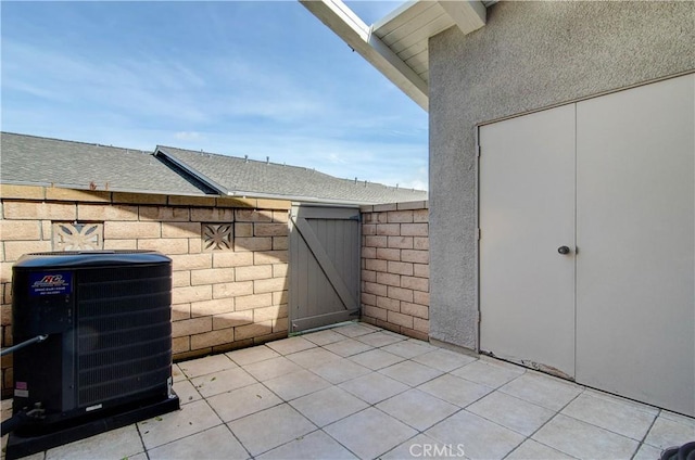 8566 Larkhall Cir Unit 809D, Huntington Beach, CA 92646 - view of patio / terrace with central air condition unit, fence, and a gate