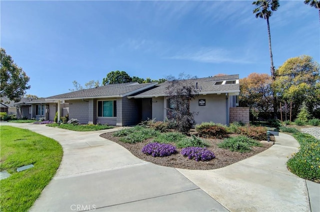 8566 Larkhall Cir Unit 809D, Huntington Beach, CA 92646 - view of front facade with stucco siding