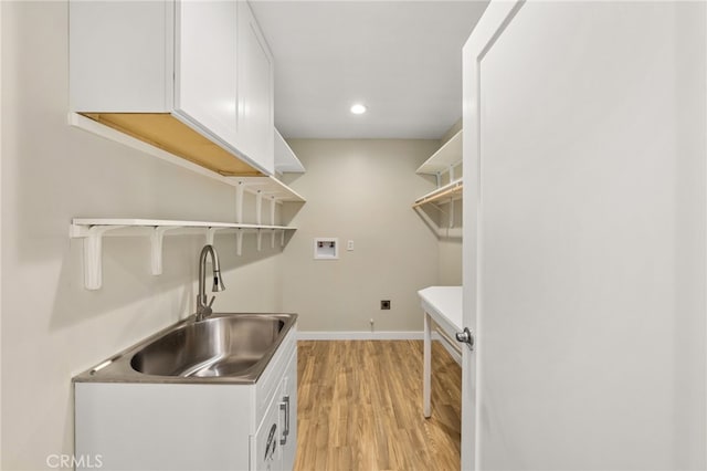 60785 La Brisa Dr, Joshua Tree, CA 92252 - laundry room with hookup for a washing machine, light wood-style floors, baseboards, cabinet space, and recessed lighting