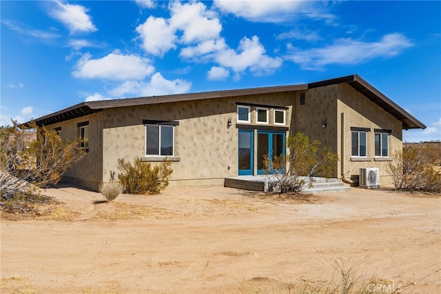 60785 La Brisa Dr, Joshua Tree, CA 92252 - rear view of property with a cooling unit