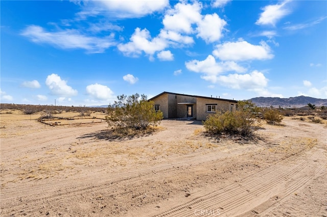 view of front of property with a mountain view