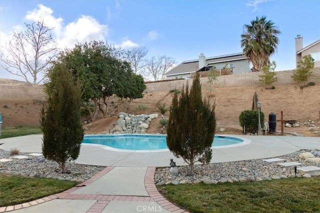 view of swimming pool featuring a patio