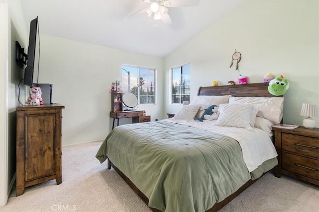 carpeted bedroom featuring lofted ceiling and ceiling fan