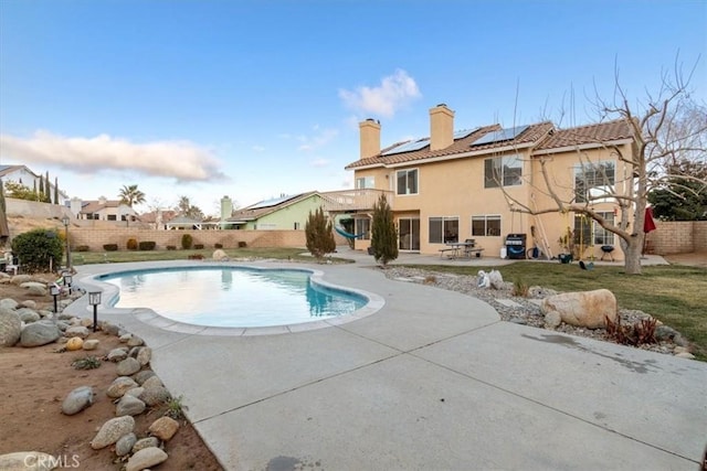 view of pool featuring a patio area