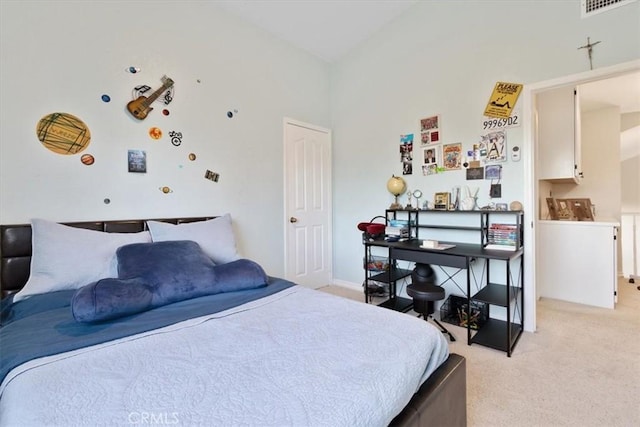 bedroom featuring light carpet