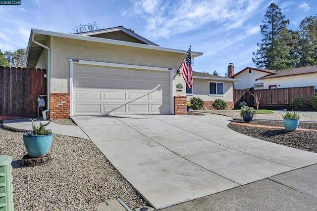 ranch-style house featuring a garage