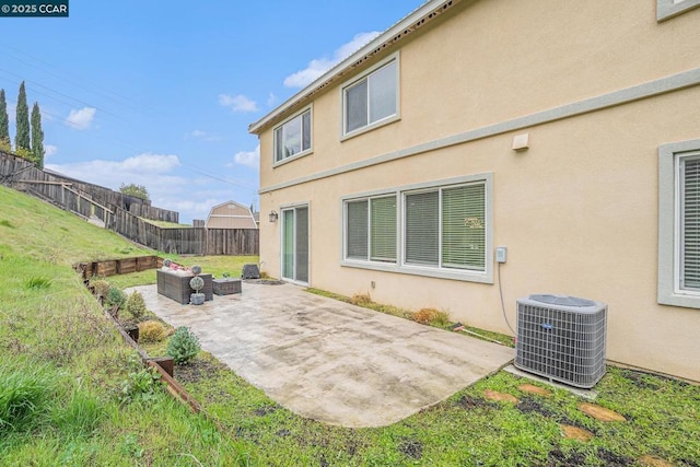 rear view of house with an outdoor hangout area, a yard, a patio area, and central air condition unit