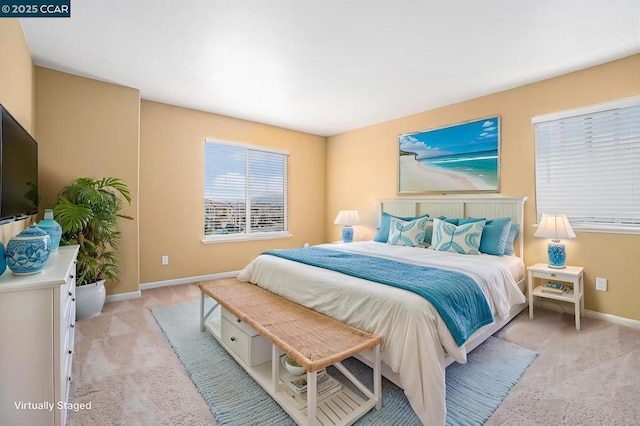 bedroom featuring light colored carpet