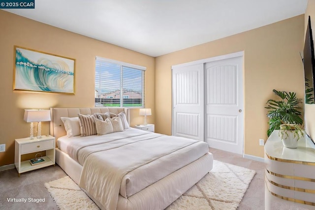 carpeted bedroom featuring a closet