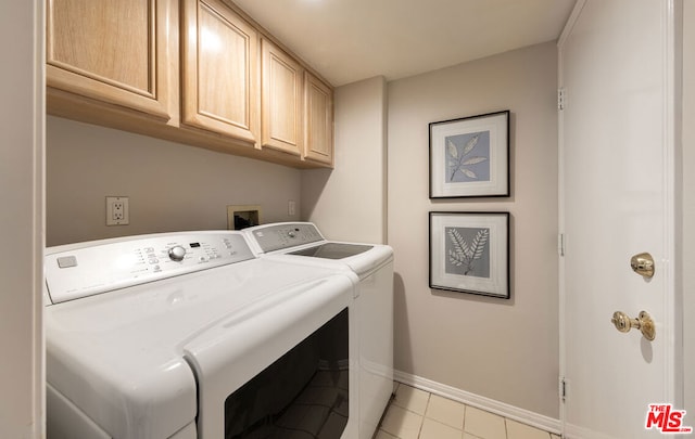 washroom with cabinets, light tile patterned flooring, and independent washer and dryer