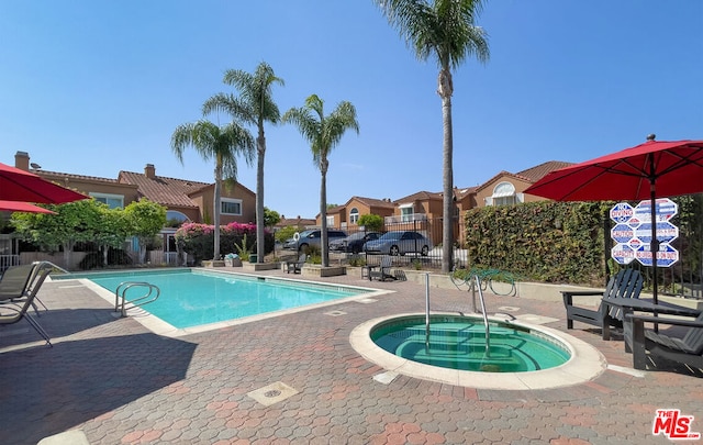 view of pool featuring a community hot tub