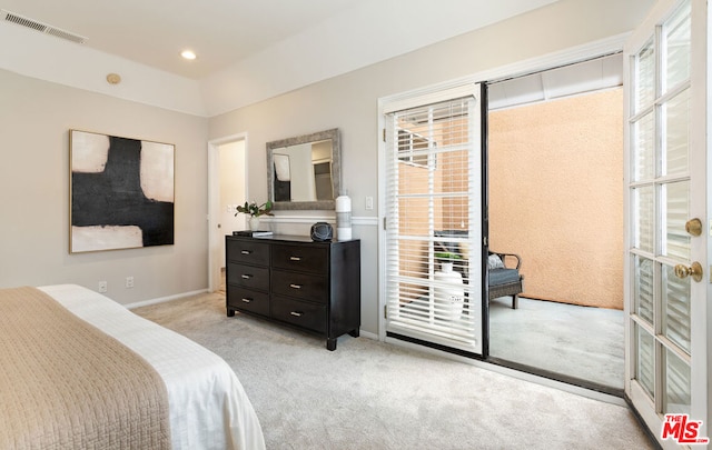 bedroom featuring light carpet, multiple windows, and access to outside