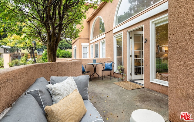 view of patio with a balcony