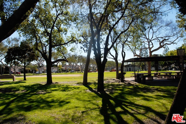 view of home's community featuring a lawn