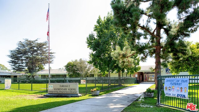 view of property's community with a yard