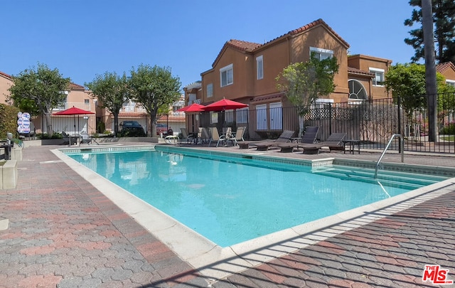 view of swimming pool featuring a patio