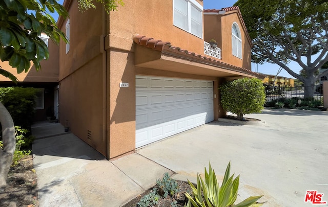 view of property exterior featuring a garage