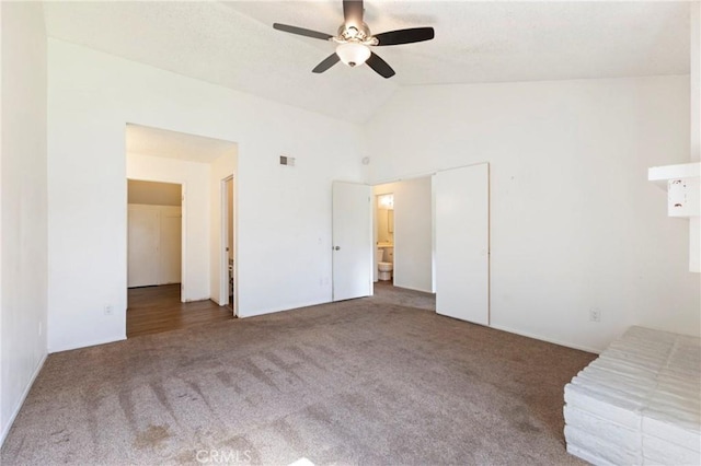 unfurnished bedroom with carpet floors, lofted ceiling, and ceiling fan