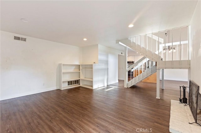 unfurnished living room featuring dark hardwood / wood-style flooring