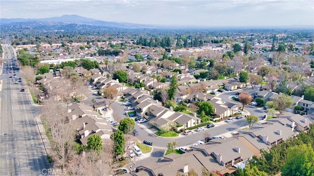 birds eye view of property with a mountain view