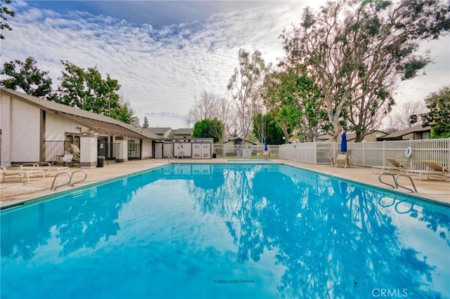 view of swimming pool featuring a patio area