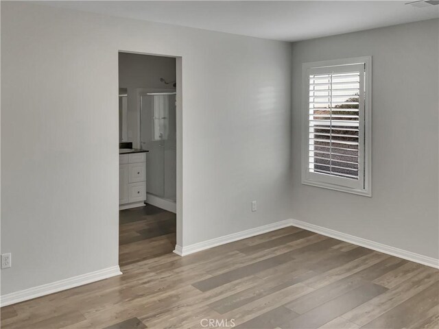 unfurnished room featuring light hardwood / wood-style floors