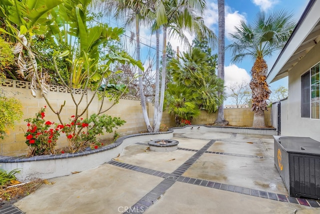 view of patio / terrace with a fire pit