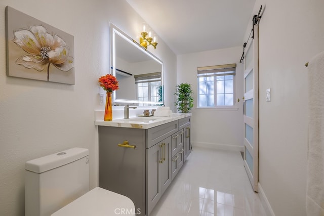 bathroom featuring vanity and toilet