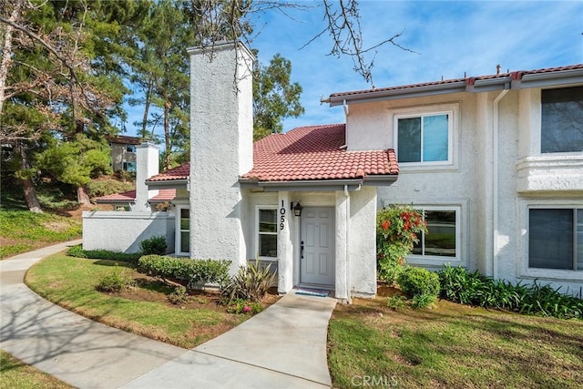 view of front of house with a front lawn