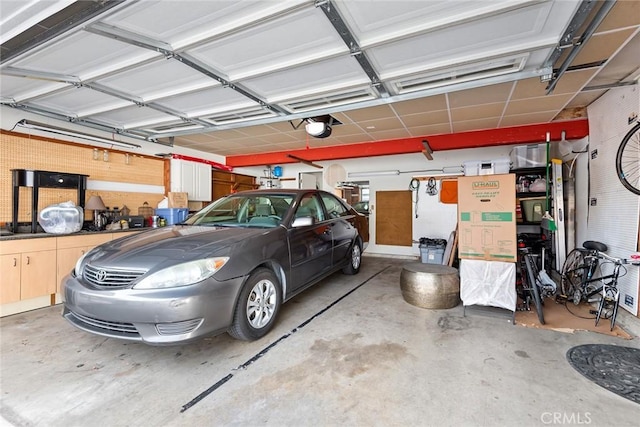 garage featuring a garage door opener