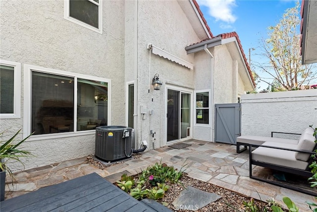 exterior space with a patio and central AC unit