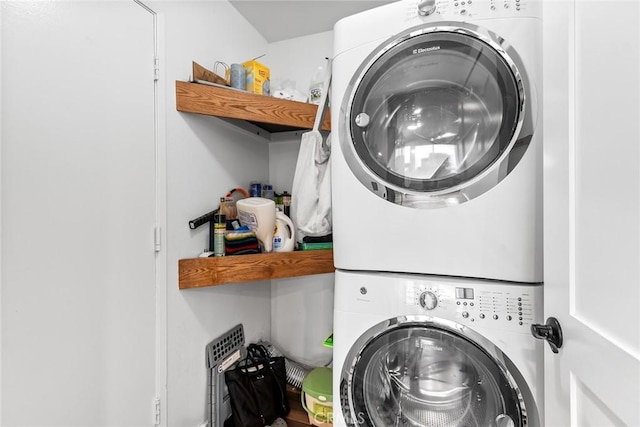 laundry room featuring stacked washer and dryer