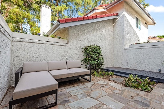 view of patio featuring a wooden deck and outdoor lounge area