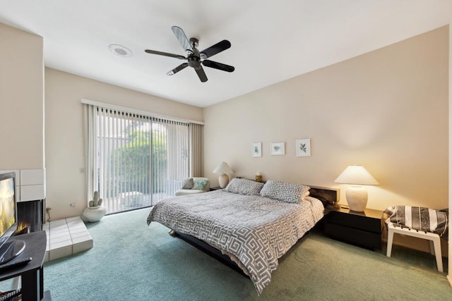 bedroom with ceiling fan, carpet flooring, and access to exterior