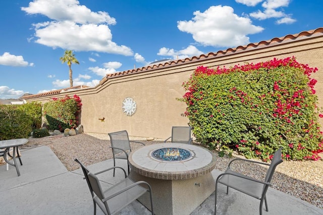 view of patio / terrace featuring a fire pit