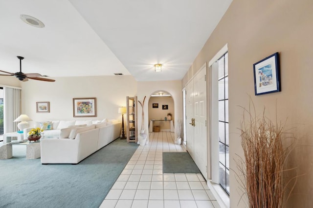 living room with light colored carpet and ceiling fan