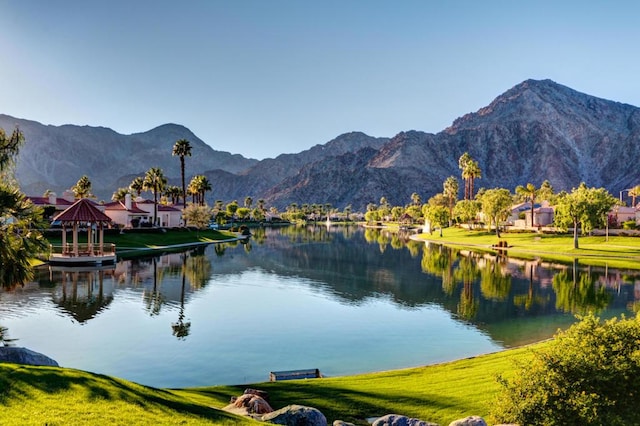 view of water feature with a gazebo and a mountain view