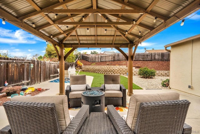 view of patio / terrace with a gazebo and an outdoor living space with a fire pit