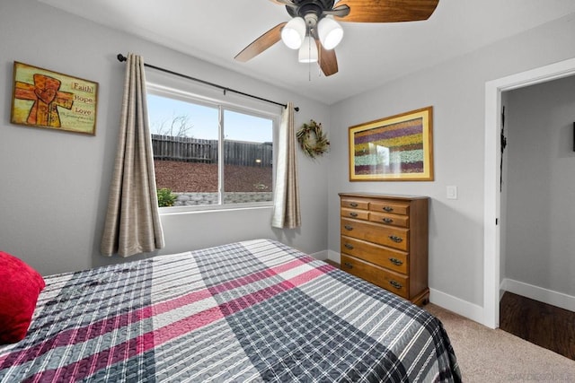 bedroom with ceiling fan and carpet floors