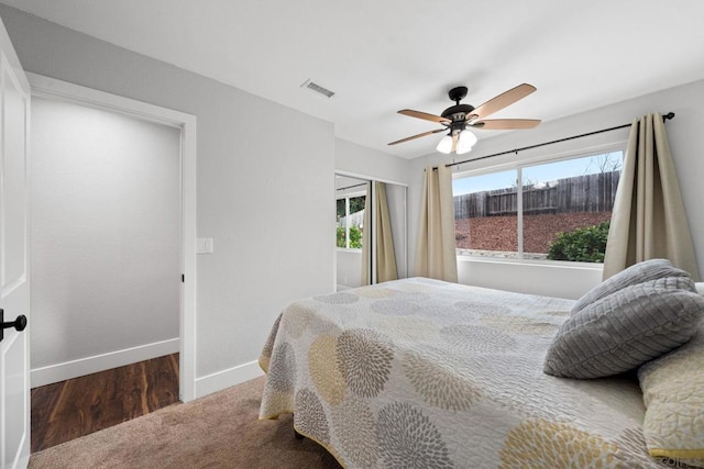 bedroom with ceiling fan and dark hardwood / wood-style floors