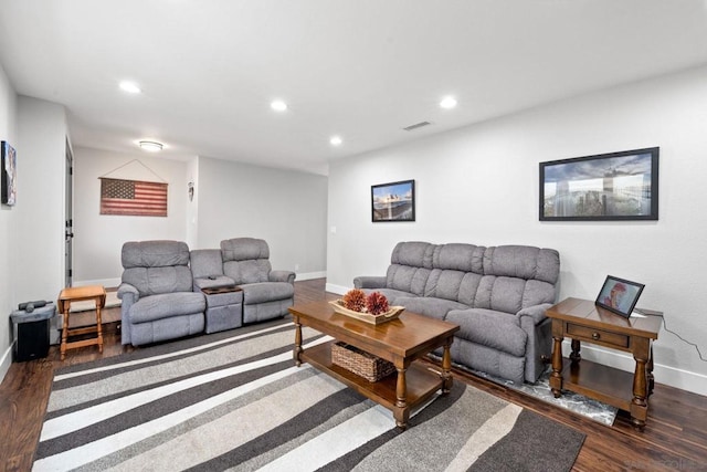 living room with dark hardwood / wood-style flooring