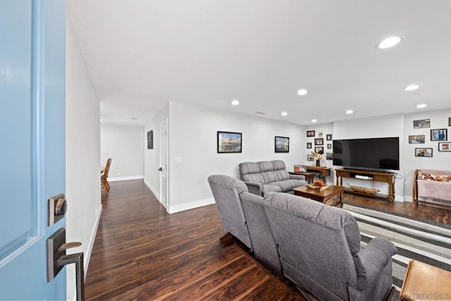 living room with dark hardwood / wood-style flooring