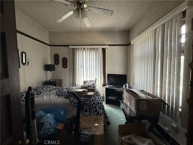1490 W 51st St, Los Angeles, CA 90062 - carpeted bedroom with a textured ceiling and a ceiling fan